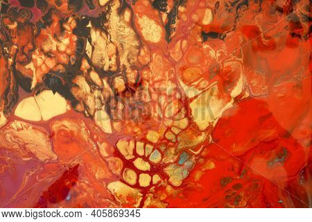 Art Abstract flow acrylic and watercolor marble blot painting. Red, black and gold Color wave horizontal texture background.
