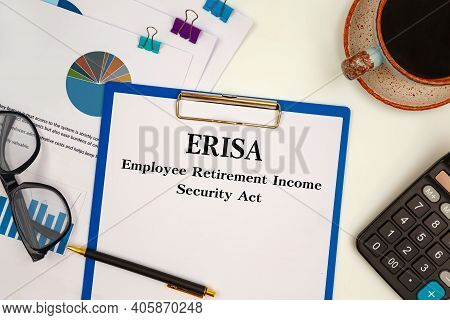 Paper With Erisa - Employee Retirement Income Security Act On The Table, Calculator And Glasses