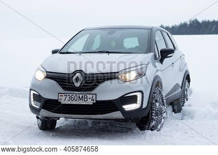 Grodno, Belarus-01.31.2021: Renault Capture Or Renault Captur Suv On A Winter Road Against The Backg