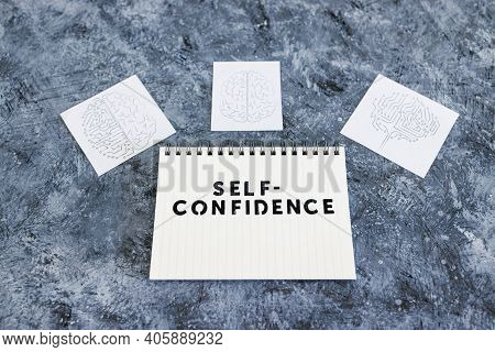Self-confidence Taxt On Notepad Surrounded By Brain Icons Symbol Of Mind And Mindset Shift, Psycholo