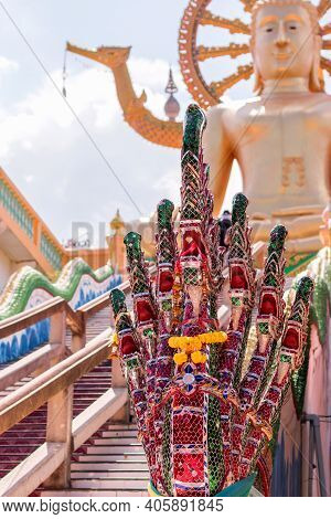 Samui, Thailand - 19 March 2018: The Serpent-like Mythical Creatures Of Nagi With A Fan Of Snake Hea