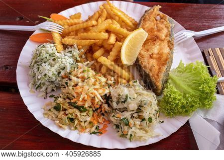 Fried Fish With Fries And Vegetable Salad