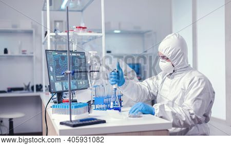 Researcher Scientist Working With Micropipette In Big Scientific Lab. Chemist In Modern Laboratory D