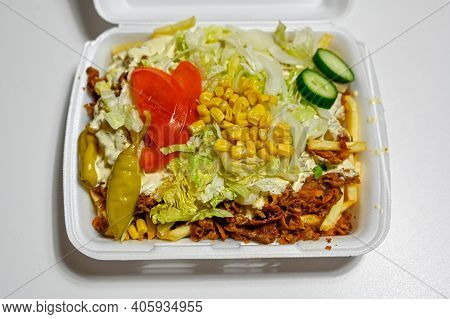 Junk Food In Plastic Box On Table