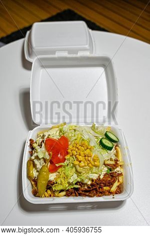 Junk Food In Plastic Box On Table