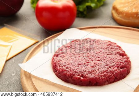 Raw Ground Beef Meat Burger Steak Cutlets On Wooden Table. Top View