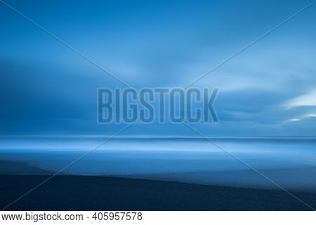 Abstract Nature Background. Minimalistic Icelandic Landscape.  Beautiful Peaceful Black Volcanic Sand Beach. Serene Nature of Vatnajokull Jokulsarlon. Iceland.