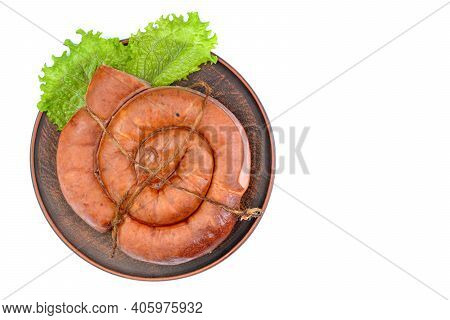 Smoked Sausage Twisted In A Spiral And Bound With A Beechnut, Isolated On A White Background.