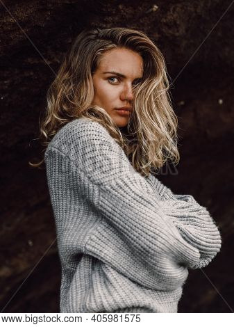 Portrait Of Attractive Young Woman In Sweater