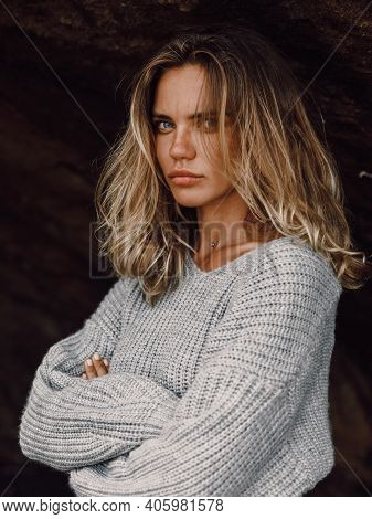 Portrait Of Attractive Young Woman In Sweater