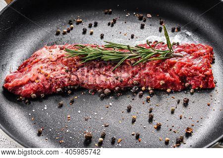 Raw Marbled Beef Steak, Fillet In A Pan With Ingredients For Cooking. Gray Background. Top View