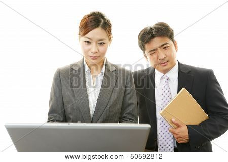 Dissatisfied businessman and businesswoman