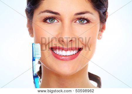 Beautiful woman with toothbrush. Dental care background.
