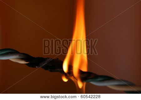 Short circuit, burnt cable, on dark color background