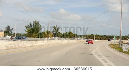 MIAMI, FLORIDA - DEC 24, 2009: Cars on road on December 24, 2009 in Miami, Florida. Miami is a city located on the Atlantic coast in southeastern Florida and the county seat of Miami-Dade County