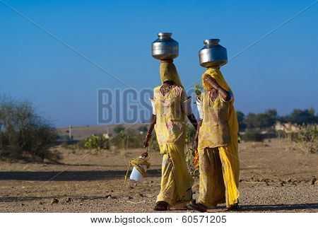 Women Carrying Water In Rajasthan