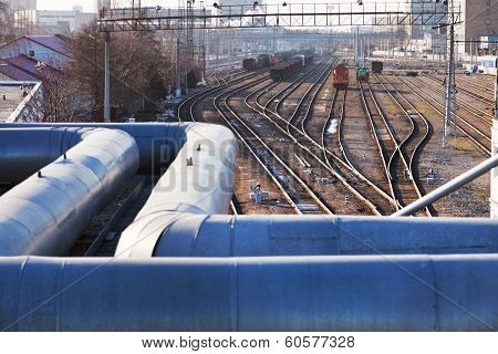 Industrial Landscape With Pipes And Railway Lines