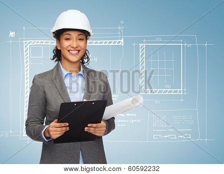 building, developing, consrtuction and architecture concept - smiling businesswoman in white helmet with clipboard and blueprint