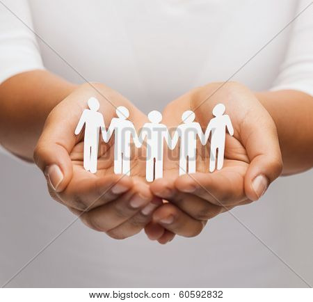 relationships and love concept - womans hands showing paper cutout team