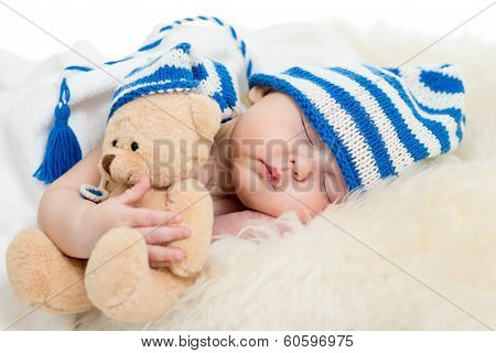 Newborn Baby Sleeping On Fur Bed