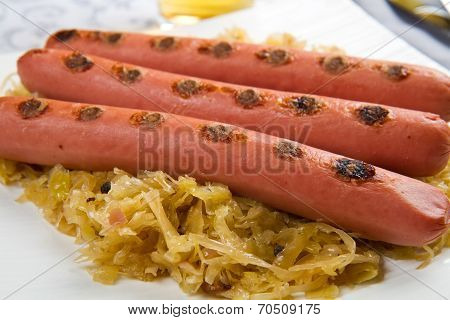 Dish With Roasted Wurstel And Sauerkraft