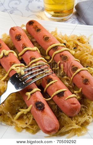 Dish With Roasted Wurstel And Sauerkraft