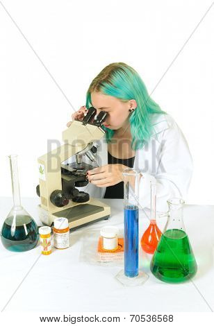 Researcher in a Cannabis testing laboratory checking samples in a microscope