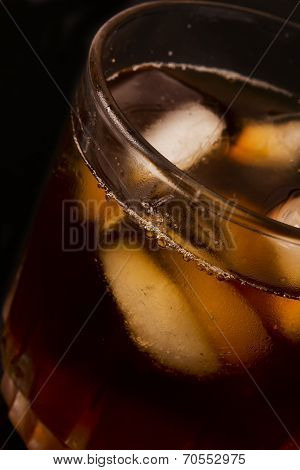 glass with dark liquid