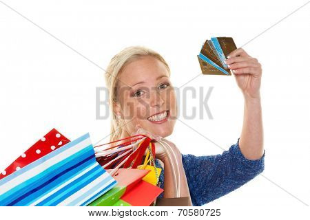 a young woman with colorful shopping bags while shopping. using credit cards for cashless payment