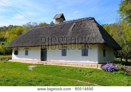 Old Farmhouse With A Thatched Roof