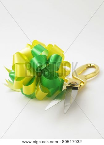 green yellow ribbon bows and scissors