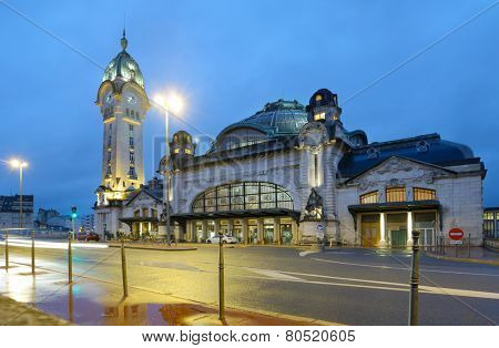 LIMOGES, FRANCE - SEPTEMBER 9, 2013: Limoges-Benedictins Train Station in evening. Built in 1929, it's considered as one of the most beautiful train station in the world