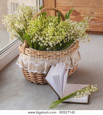 Basket With Lilies Of The Valley (convallaria Majalis) And Notebook With Blank Pages