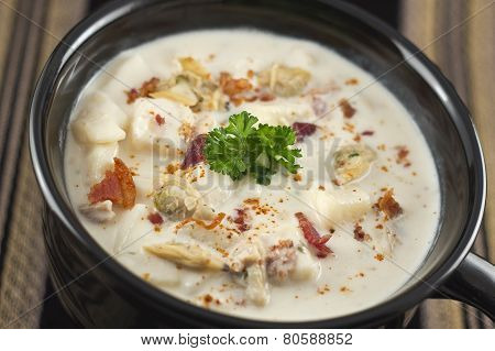 Creamy New England Clam Chowder garnished with parsley