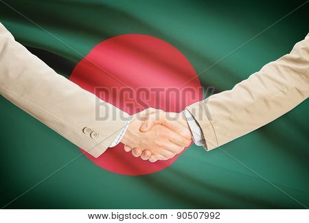 Businessmen Handshake With Flag On Background - Bangladesh