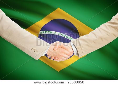 Businessmen Handshake With Flag On Background - Brazil