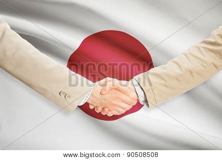 Businessmen Handshake With Flag On Background - Japan