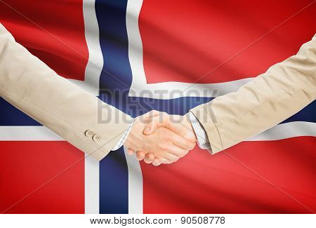 Businessmen Handshake With Flag On Background - Norway