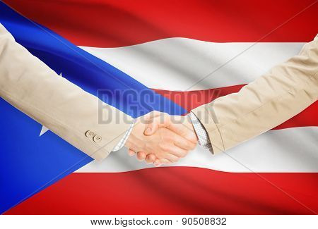 Businessmen Handshake With Flag On Background - Puerto Rico