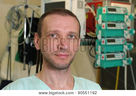 Portrait Of  Male Nurse Icu  In A Green Uniform.