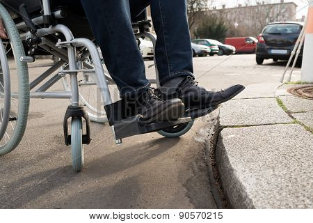 Man Sitting On Wheelchair