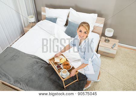 Maid With Breakfast Tray In Hotel Room