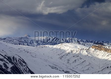 Winter Mountains At Evening And Storm Clouds