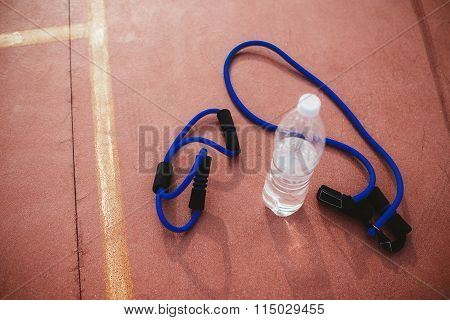 Sports Equipment expander and a bottle of water