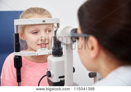 optician with tonometer and patient at eye clinic