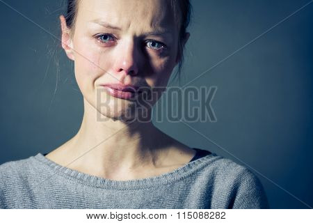 Young woman suffering from severe depression/anxiety/sadness