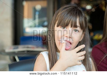 Small Little Girl Licks His Fingers Made Of Ice Cream