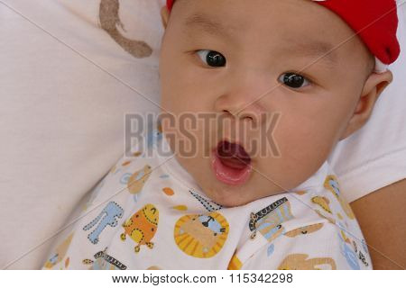 Asian Baby Boy Is Looking And Opening His Mouth.