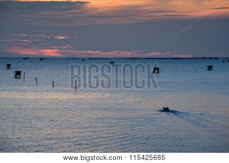 Sunrise time Boat and Thai fisherman village in Bangtaboon Petchaburi Thailand