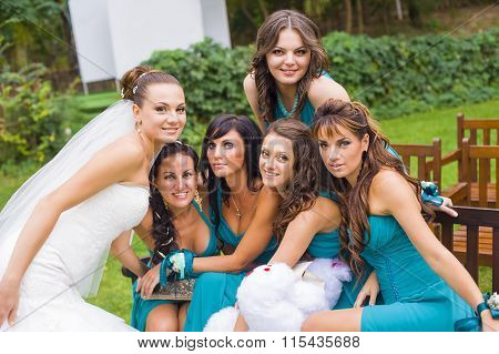The bride and  bridesmaids in the garden.